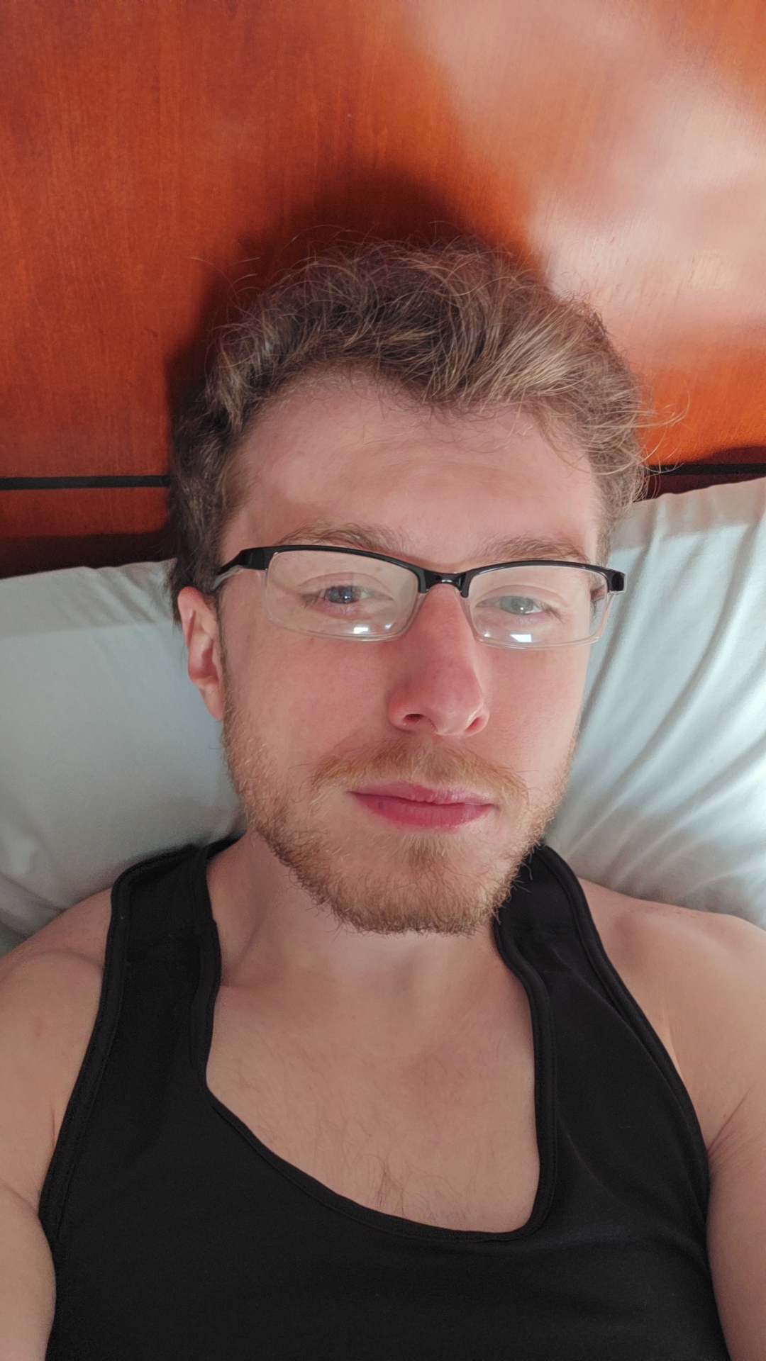 Bryce at home, wearing glasses